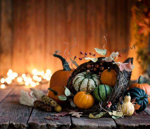 istock Autumn Thanksgiving cornucopia on a rustic wood background 1035916146