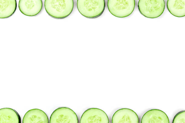 istock Cucumber slices forming a frame on a white background with copyspace 1035924158