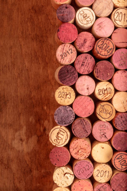 istock Wine corks background, overhead photo of red and white wine corks with copy space 1035924194