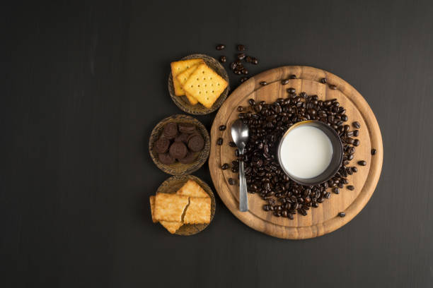 coffee bean and Biscuit on wood board color black stock photo