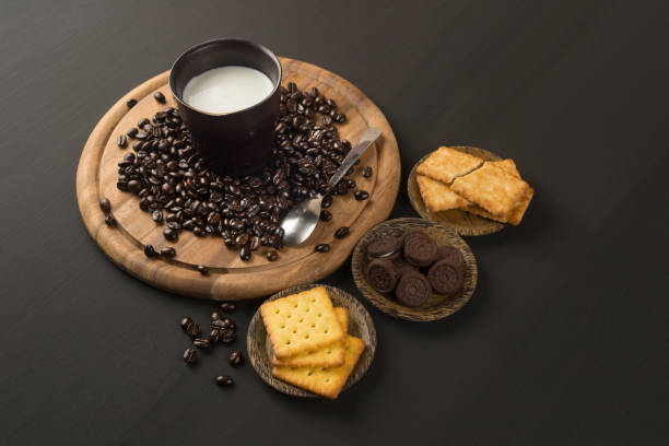 coffee bean and Biscuit on wood board color black stock photo