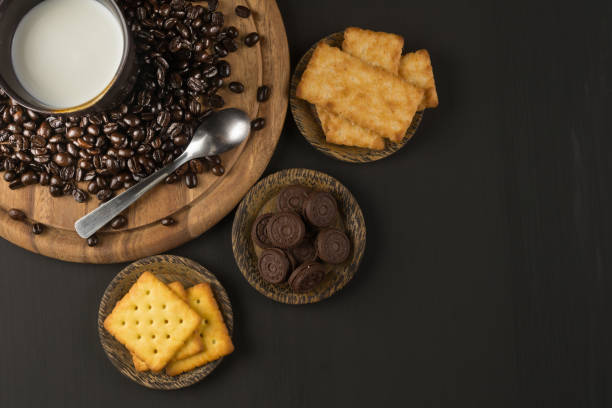 coffee bean and Biscuit on wood board color black stock photo