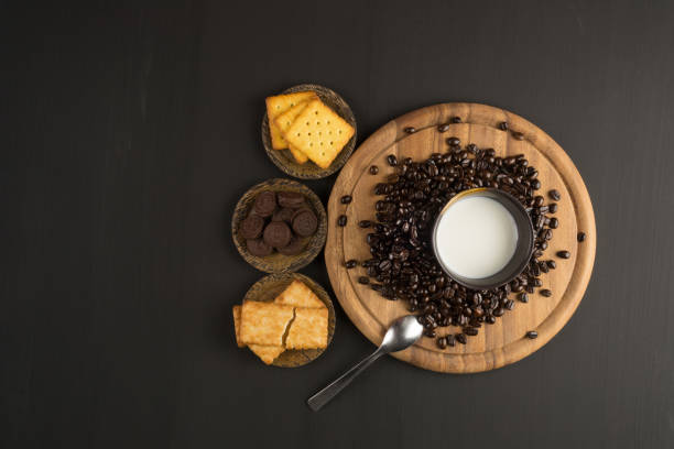 coffee bean and Biscuit on wood board color black stock photo