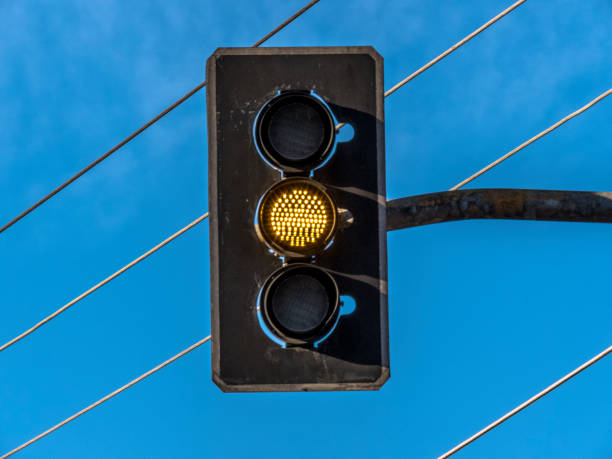 istock Yellow Traffic lights over blue sky background 1035927796