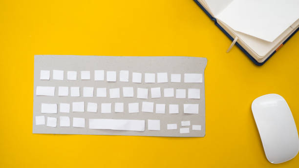 istock Office desk table Top view with keyboard and mouse  yellow background cut style 1035941872
