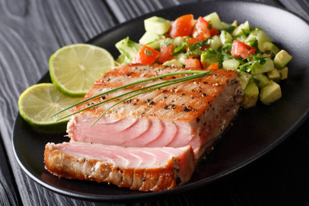 istock Mexican tuna steak with avocado cucumber salsa closeup. horizontal 1035956586