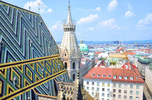 Fragment of colorful roof tiles mosaic. Stephansdom cathedral from its top in Vienna, Austria