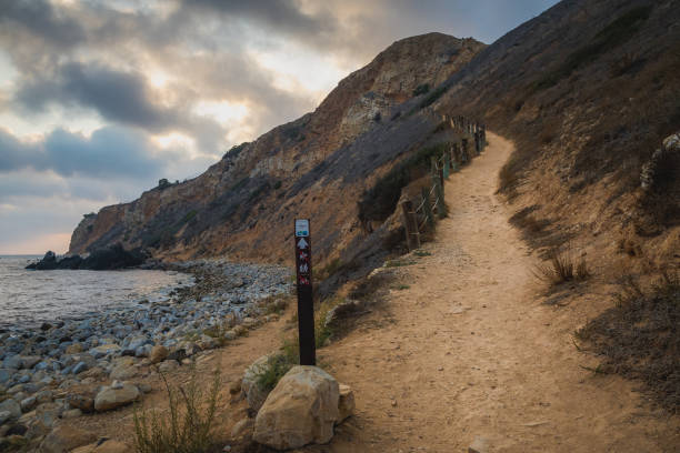 Dramatic Tovemore Trail Dramatic view looking up at the steep Tovemore Trail from the bottom of the rugged cliffs of Pelican Cove, Rancho Palos Verdes, California rancho palos verdes stock pictures, royalty-free photos & images