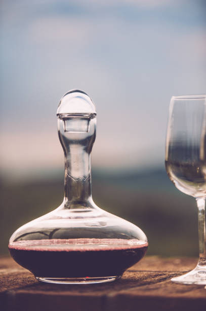 Red Wine In Decanter With Glasses On Sunset
