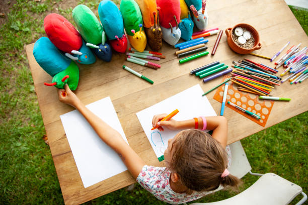 istock Young Girl Drawing at Summer Art's Class 1035970354