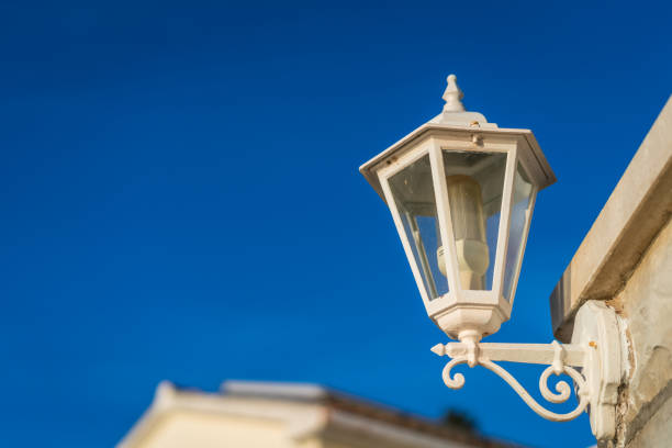 istock Old white metal lamp on the wall 1035970518