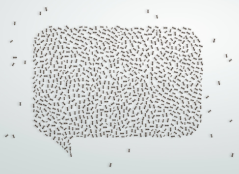 Ant Crowd Forming A Big Speech Bubble Symbol on white background