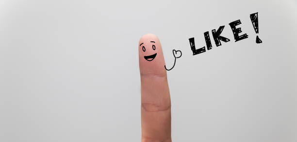istock Happy finger giving thumbs up, written LIKE with copy space 1035974758