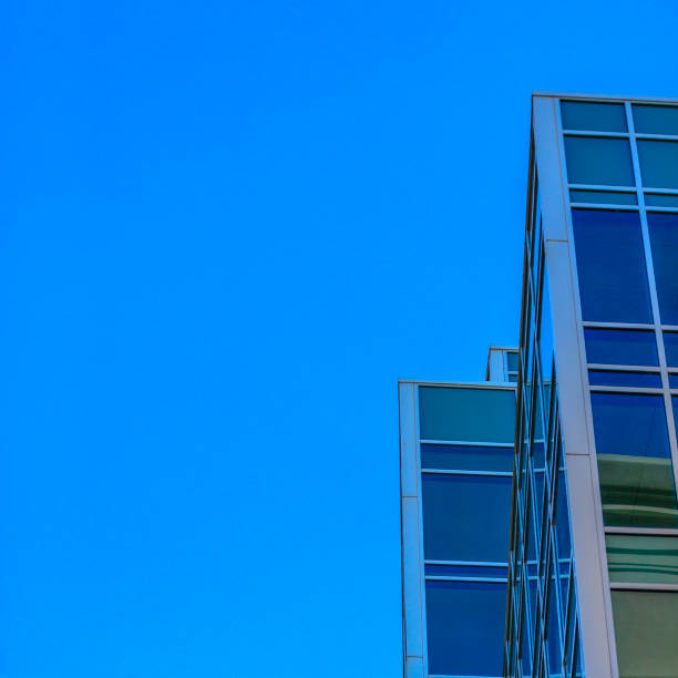 istock Sky reflected in windows of a modern building 1035974996