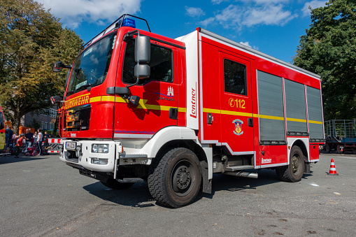 Hamburg, Germany - September 02. 2018: German fire engine parked on a public parking lot during a charity event in Hamburg, Germany.