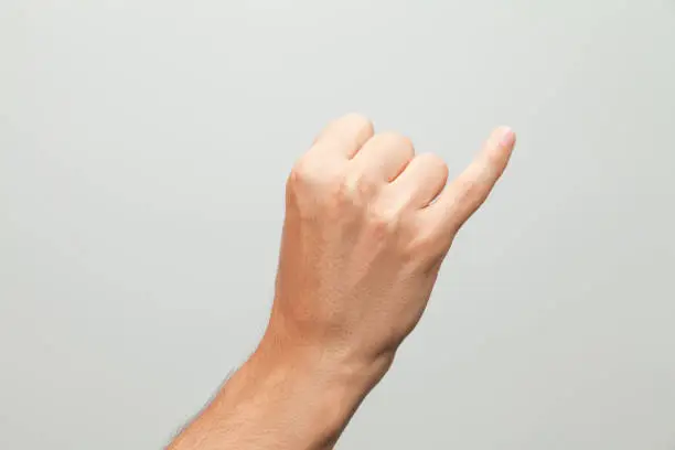 Photo of Male hand doing promise gesture, pinky swear