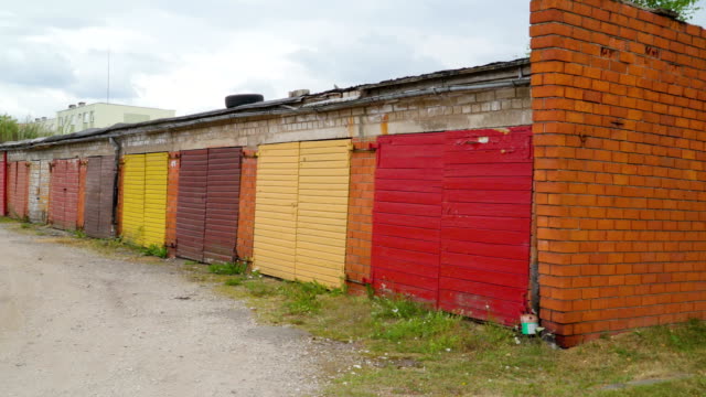 Closer look of the colorful gates of the wooden bunk houses