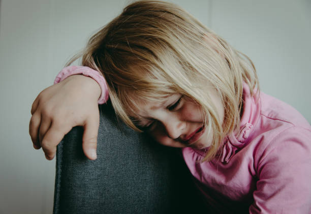 istock crying child, depression and sadness, abuse, exhaustion 1035985602
