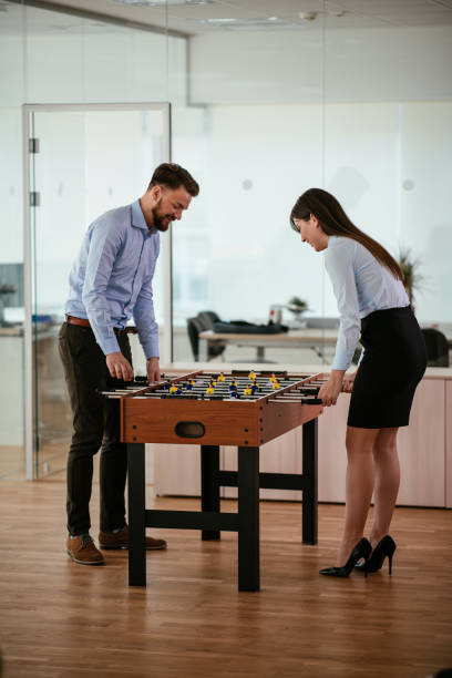 istock Coworkers playing foosball 1035985718