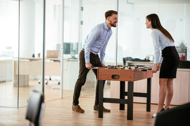 istock Coworkers playing foosball 1035988136