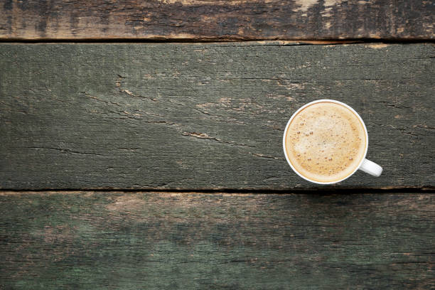 istock Cup of coffee on gray wooden table 1035988320