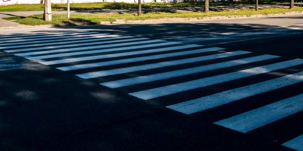 istock pedestrian crossing lines on asphalt 1035991936