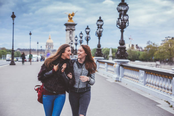 istock Happy friends in Paris on windy day 1035992200