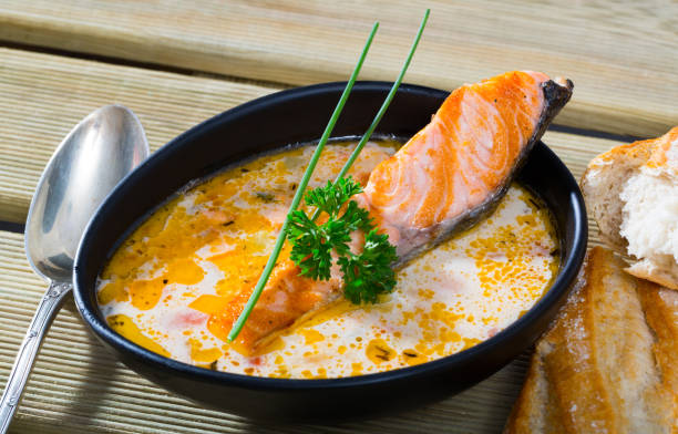 istock Creamy salmon soup with baguette 1036002808