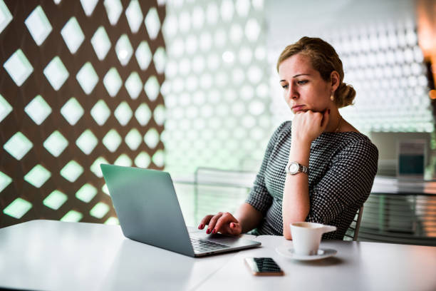 istock Young beautiful woman doing research in her modern office. 1036005954