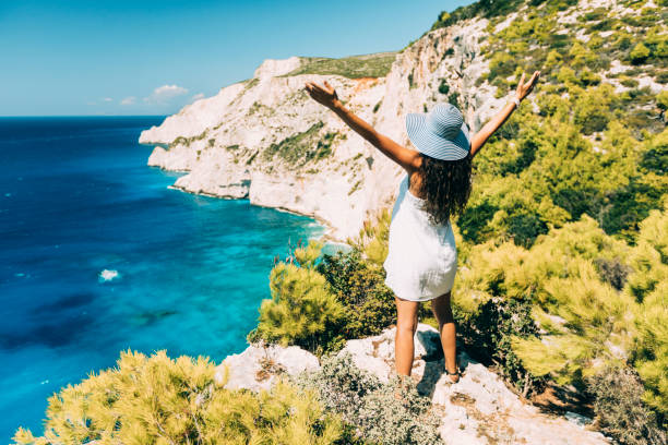 istock Woman looking in awe at sea 1036006662