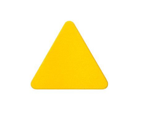 Yellow wooden block in the shape of triangle isolated on white. Construction toys.