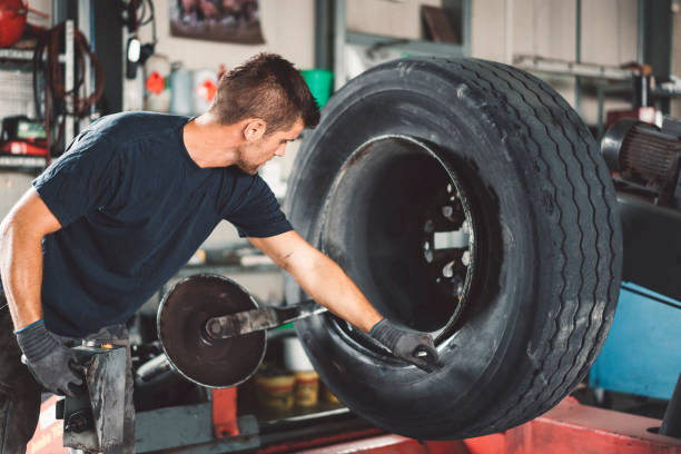 istock Removing truck tire 1036010132