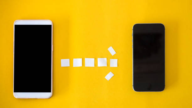 istock smartphone connect Office desk table Top view yellow background paper cut style 1036010260