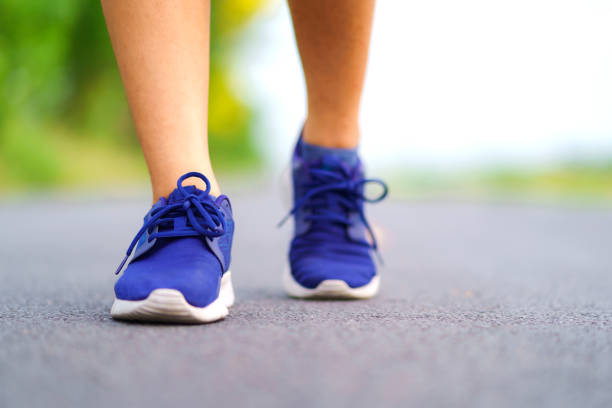 istock Woman legs walking in the park 1036012882