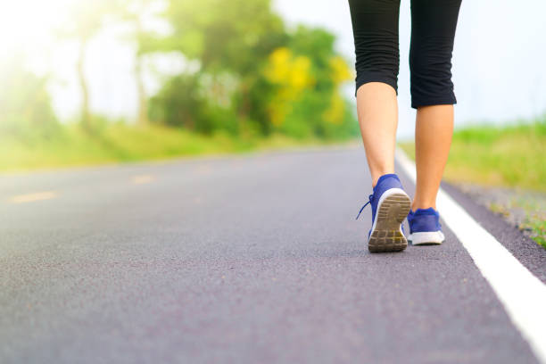 istock Woman legs walking in the park 1036012890