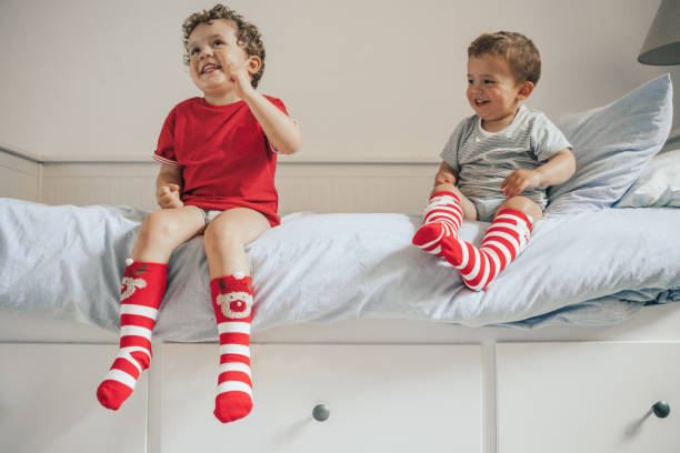 istock Brothers wearing christmas socks 1036020656