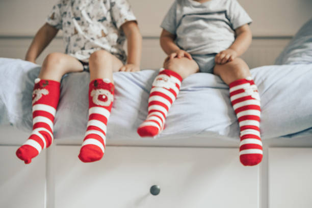 istock Brothers wearing christmas socks 1036020720