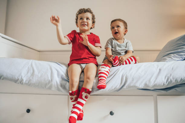 istock Brothers wearing christmas socks 1036020752