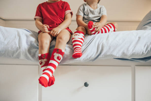 istock Brothers wearing christmas socks 1036022802