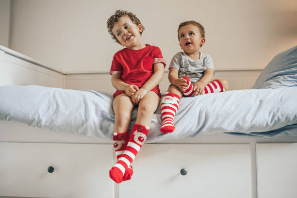 istock Brothers wearing christmas socks 1036022810