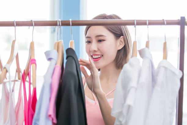 istock woman choosing clothes in showroom 1036024500