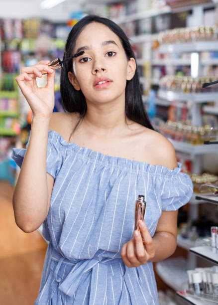 istock Girl testing mascara in shop, testing before buying 1036027156