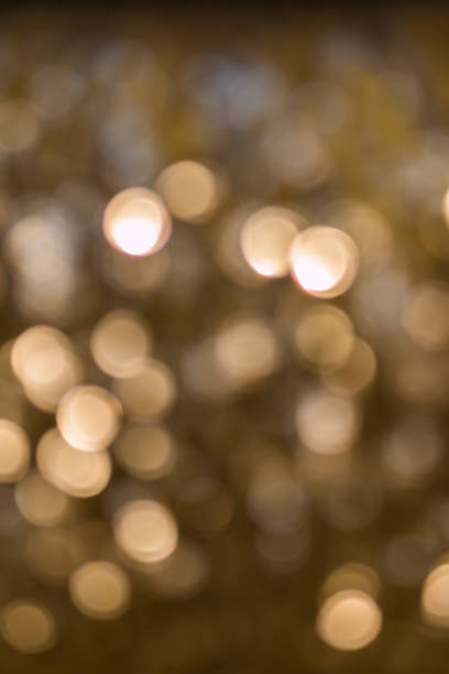 istock Defocused golden bokeh glowing in the dark 1036027186