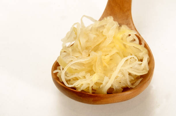 istock fresh home made sauerkraut on a wooden spoon 1036031126