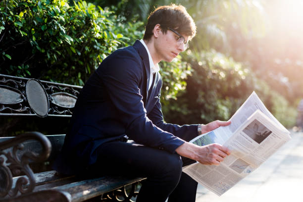 istock Businessman reading newspaper in the morning 1036039782
