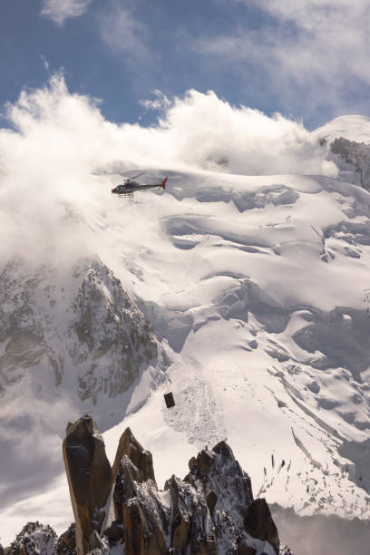 istock Helicopter flying in the  Alps 1036040518
