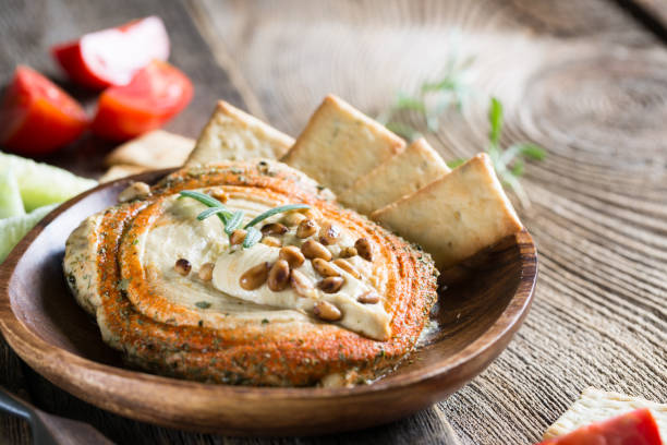 istock Hummus with paprika and pine nuts 1036041422