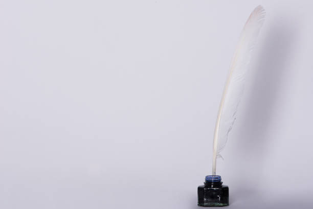 istock White background with inkwell, educational, school. Signing the contract. 1036041424