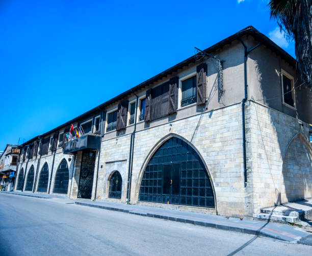 Antakya, Turkey, May 30, 2017; Savon Hotel has been built as a soap and olive oil factory in 1860’s during the Ottoman period. The original building was in U shape which had rooms at the sides and a courtryard in the middle. The structure of the building was made out of stone vaults and arcades. This type of architectural style was also common in cities like Gaziantep, Urfa and Aleppo. The factory was bought in 1930 and contunied its operations until early 1960’s. Since then the building was closed until 2001. In 2001, after going through a two year renovation, this historical building opened its doors to the public as a beautiful hotel.