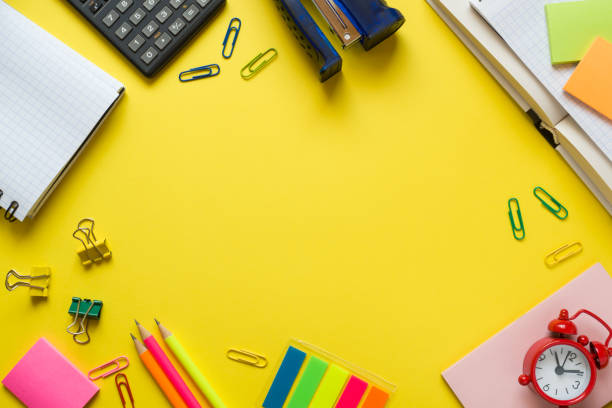istock Office supplies on yellow table with copy space. Education concept, school and office. 1036049166